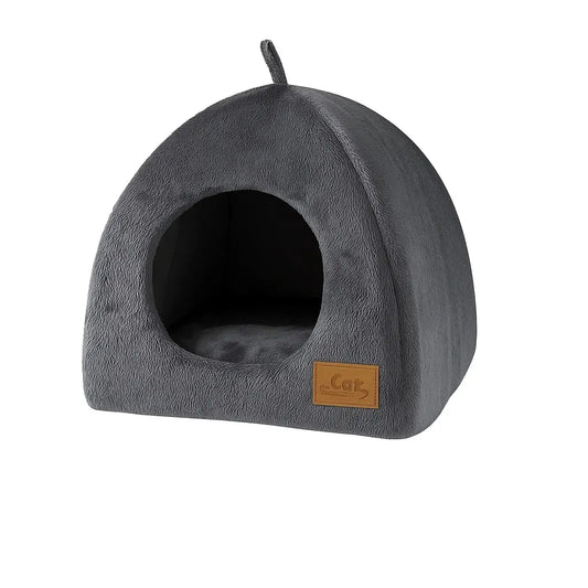 A soft Plush Triangle Cat Bed with a triangular shape, providing a warm and secure sleeping space for cats.