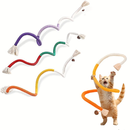 Set of colorful cat toys with a cat interacting with one of them on a white background