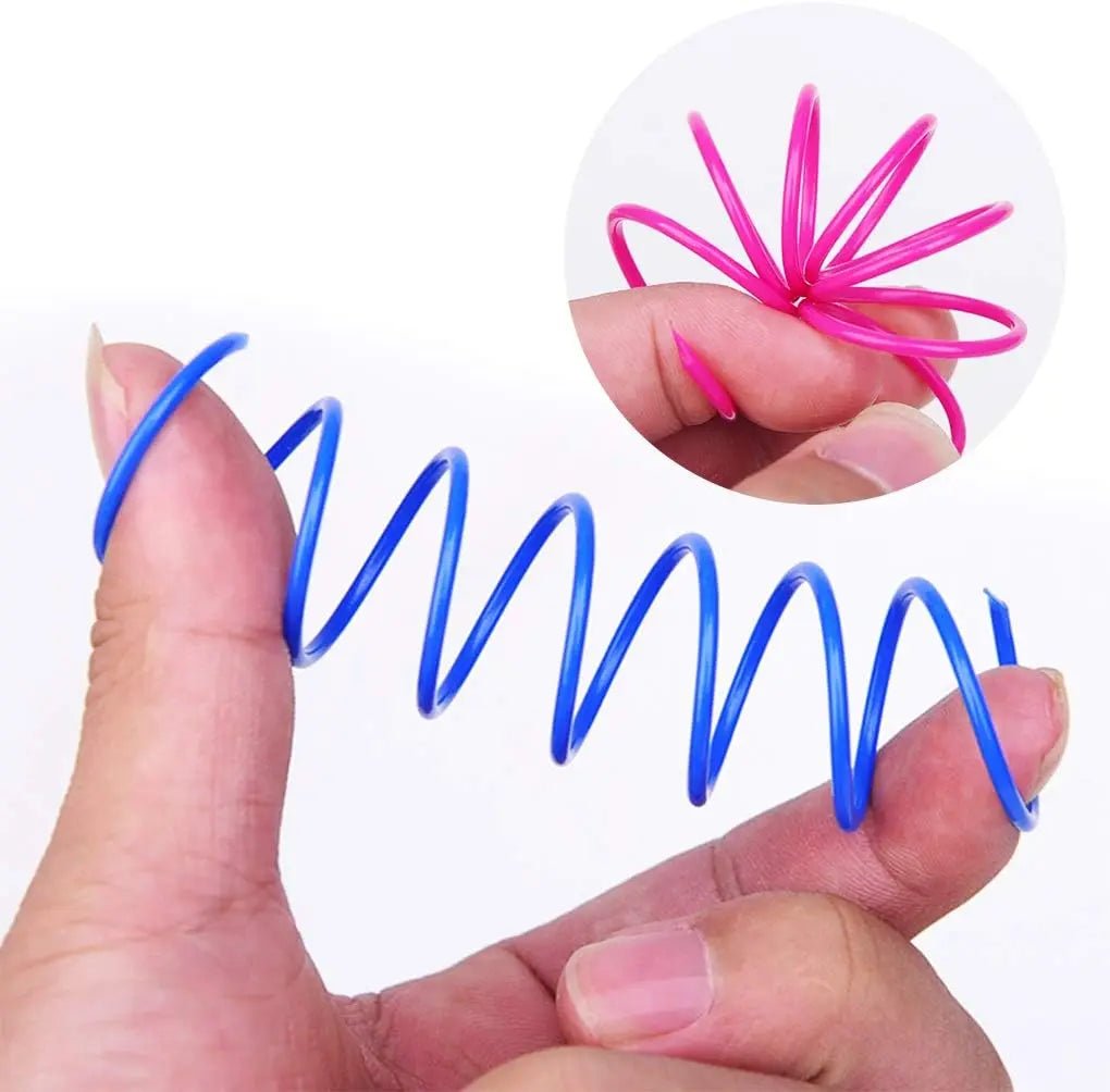 A flexible blue spring toy held in hand, showing its lightweight and durable design